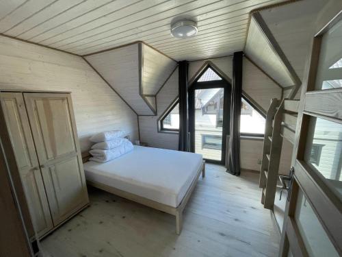 Ένα ή περισσότερα κρεβάτια σε δωμάτιο στο Comfortable holiday homes close to the beach