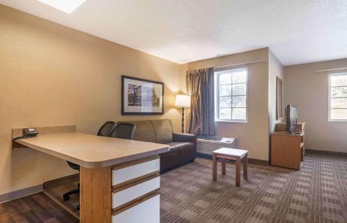 a living room with a couch and a table at Extended Stay America Suites - Louisville - Alliant Avenue in Louisville