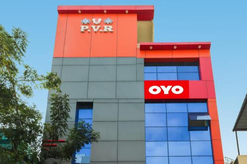 a building with aynore logo on the side of it at Collection O Sri Subhamastu Grand in Vijayawada
