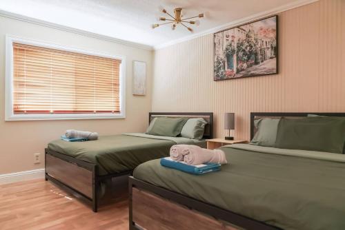 two beds with stuffed animals on them in a bedroom at VacationHome with Spa Pool & Relaxing Gardenyard in Las Vegas