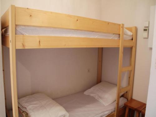 two bunk beds in a small room at Jonquilles apartment for 4 people in Châtel