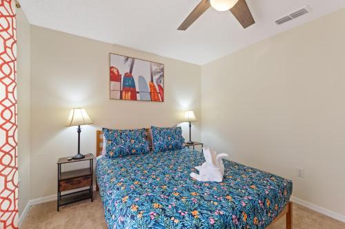 a bedroom with a bed and a ceiling fan at Luxe 3BR 2BA Oasis with Pool & Designer Touches, Disneyland, Legoland in Haines City