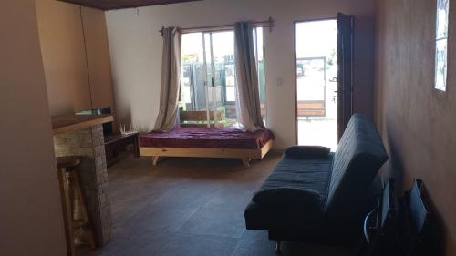 a living room with a couch and a window at Vicenzo in Melo