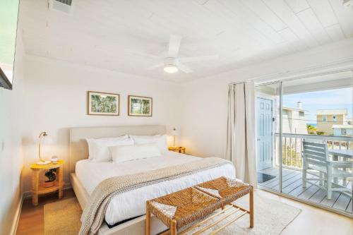 a bedroom with a bed and a balcony at Grayt Days By Stay on 30A, Gulf View, 2 Bikes in Santa Rosa Beach