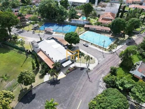 an aerial view of a city with two swimming pools at Casa Condomínio Luxo Cop 30 in Ananindeua