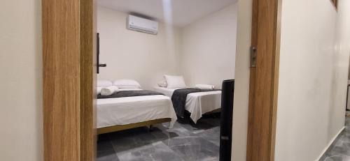 Ein Bett oder Betten in einem Zimmer der Unterkunft Hotel RUTA365