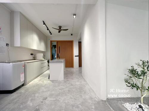 a kitchen with white appliances and a ceiling at Room l 4min Walks to Pelangi Plaza in Johor Bahru