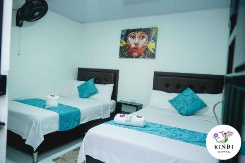 Postel nebo postele na pokoji v ubytování HOTEL KINDI Orito