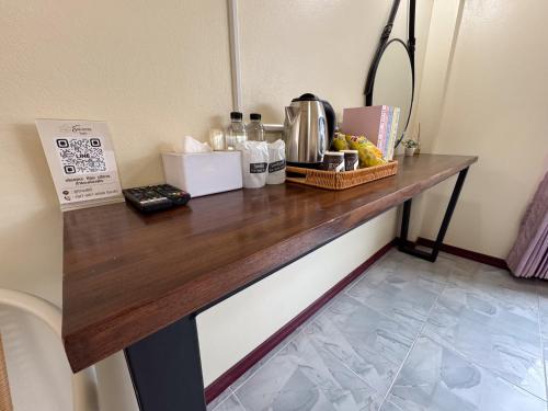 a counter in a hotel room with food on it at Aivarata Resort in Ban Phra Trong