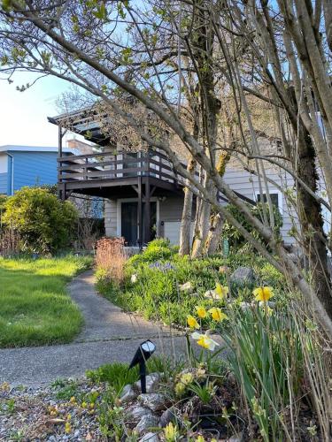 a house with a porch and a walkway in a garden at Peaceful Home-Centrally Located West Hill, Kent in Kent