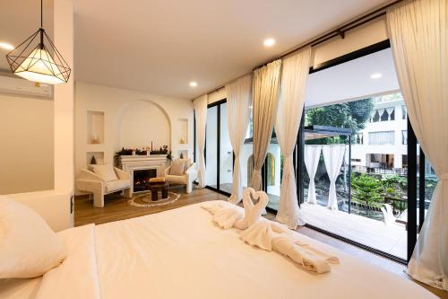 Postel nebo postele na pokoji v ubytování Inthada At Mae Kampong Chiang Mai