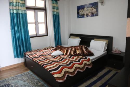 Ένα ή περισσότερα κρεβάτια σε δωμάτιο στο Sky View Homestay