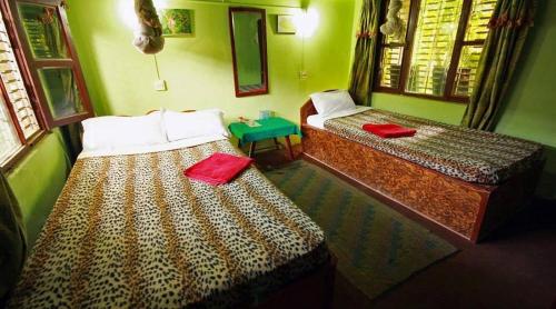 Chitwan Gaida Lodge - Animal Lovers & Birdwatchers Paradiseにあるベッド