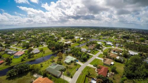 an aerial view of a town with a river at Heron's Nest in Port Saint Lucie