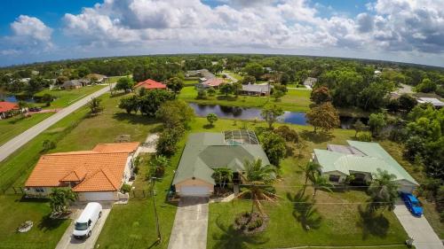 an aerial view of a house with a river at Heron's Nest in Port Saint Lucie