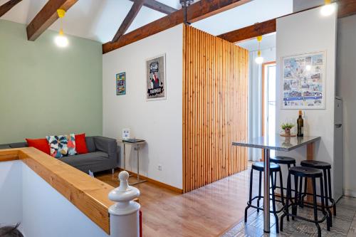 a living room with a couch and a table at Antero Quental Residence in Porto