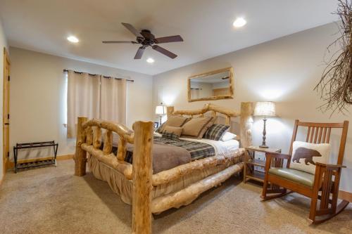 a bedroom with a bed and a ceiling fan at `Antler Ridge` Hot tub, Wifi, BBQ, River Access! in Packwood