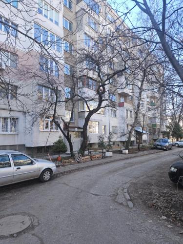 a car parked on a street in front of a building at Apartment Mladost 1 in Sofia