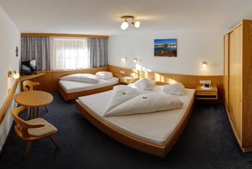 Postel nebo postele na pokoji v ubytování Haus Morgensonne