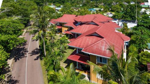 an aerial view of a house with red roofs at Praslin Paradise in Baie Sainte Anne