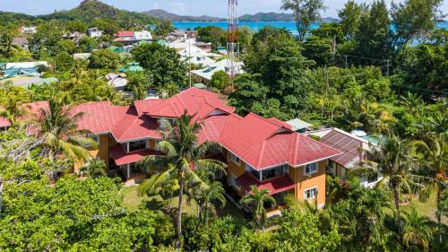 an aerial view of a house with red roof at Praslin Paradise in Baie Sainte Anne