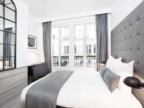 Vuode tai vuoteita majoituspaikassa LivinParis - Luxury 3 Bedrooms Le Marais I