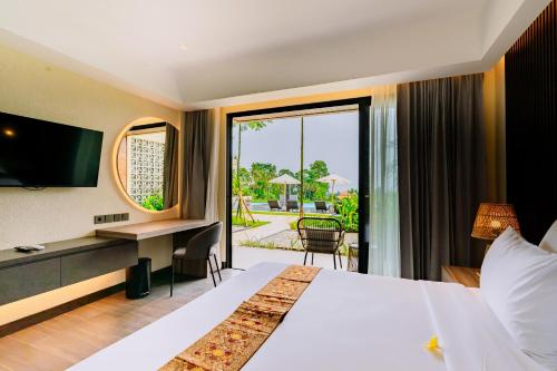 Postel nebo postele na pokoji v ubytování Big Dragon Villas Ubud