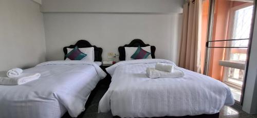 PetchPhiroon Apartmentにあるベッド