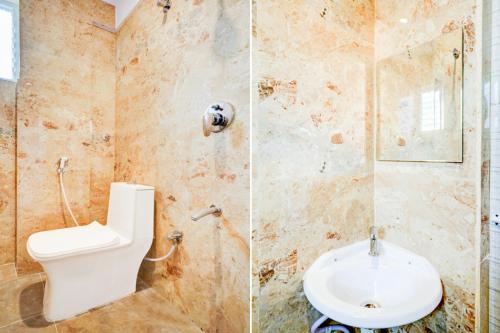 une salle de bain avec toilettes et lavabo dans l'établissement Qubenest Elite Manyata Tech Park, à Bangalore