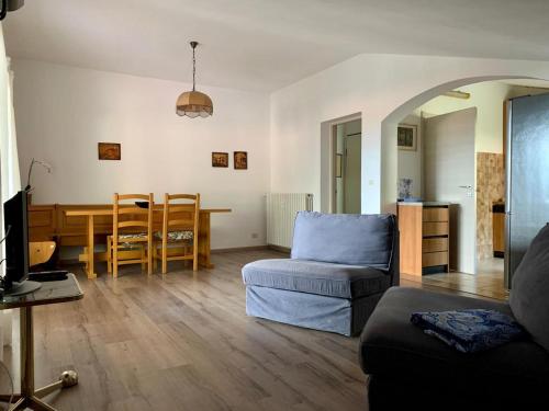 a living room with a couch and a table at The Lady of the Lake - Penthouse with Large Terrace and Lake View in Griante Cadenabbia
