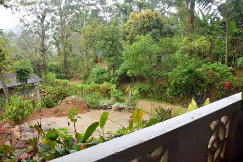 a view of a garden from a balcony at Diyathalawa Chandrika Villa in Diyatalawa