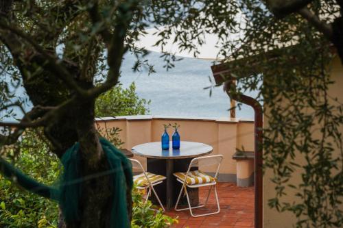 a table and chairs sitting on a patio at Casa Pernice in Lavagna