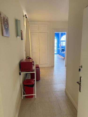 a hallway with a room with a door and a floor at Amaca in Mijas Costa