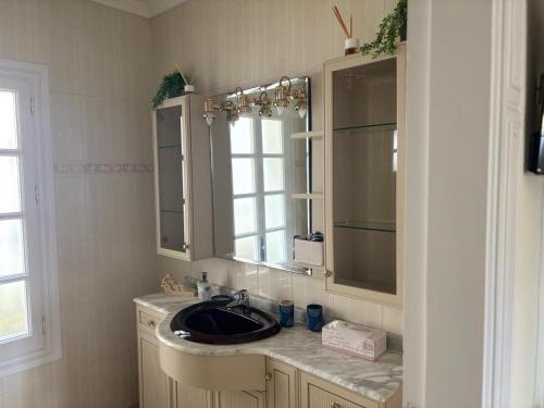 a bathroom with a sink and a mirror at Amaca in Mijas Costa