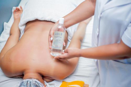 a pregnant woman with a bottle of fluid at Nefaland Hotel in Dar es Salaam