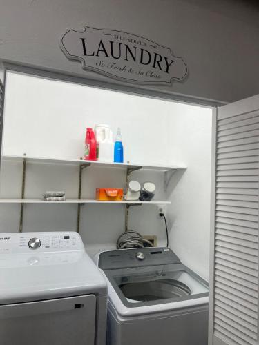 a small laundry room with a washer and dryer at Western Cabin in Corvallis