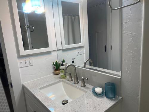 a bathroom with a sink and a mirror at Western Cabin in Corvallis