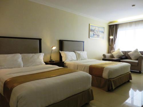 Postel nebo postele na pokoji v ubytování Plaza Hotel