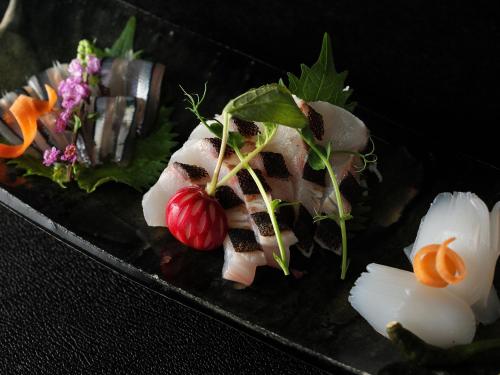 a plate of food with meat and vegetables on it at GOTO RETREAT by Onko Chishin in Goto