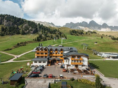 an aerial view of a hotel in the mountains at Hotel San Marco in Passo San Pellegrino