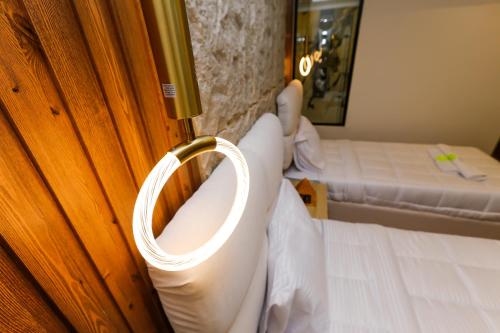 a room with two beds and a door with a ring at Pyramids moon Tower in Cairo