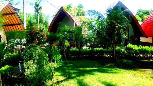 Jardin de l'établissement Family Bungalow