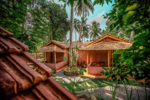 a house in the middle of a forest at Little Cabanas Udawalawe in Udawalawe