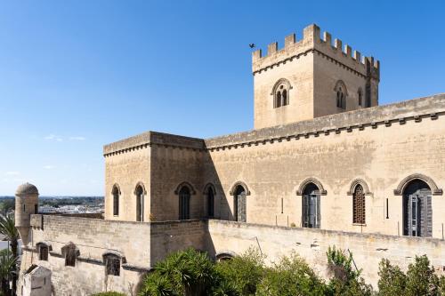 an old building with a tower on top of it at Casa vacanze Claudio e Maria Grazia in Parabita