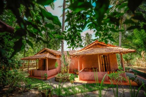 a small house in the middle of a forest at Little Cabanas Udawalawe in Udawalawe