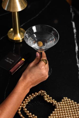 a person holding a glass bowl in their hand at CitySuites Aparthotel in Manchester