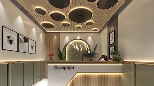 a lobby with a reception area with a reception counter at SNR CLOUD9 HOTELs in Tirupati