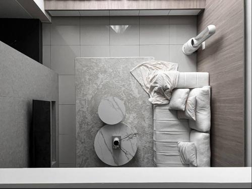 a living room with a couch and a table at Loft Suite Eko Cheras in Kuala Lumpur