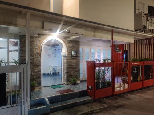 an entrance to a building with a red door at Mecasa Hotel in Boracay