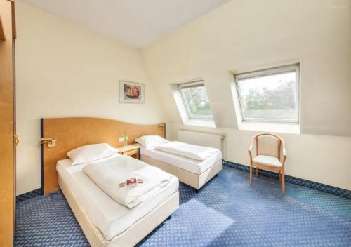 Hotel Viktoria Düsseldorf-Neuss - Self Check-Inにあるベッド
